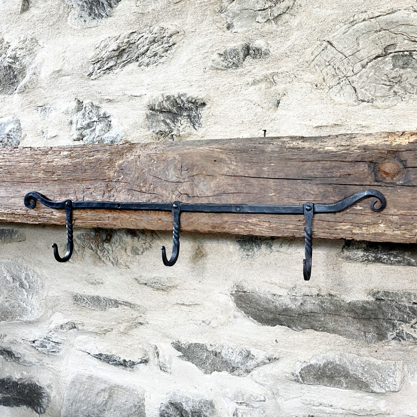 Triple hook with scrolled ends