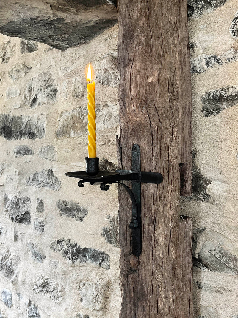 forged wall sconce with scrollwork